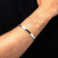 Men's torque silver bangle